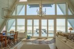 Beautiful floor to ceiling windows showcase the gorgeous ocean views